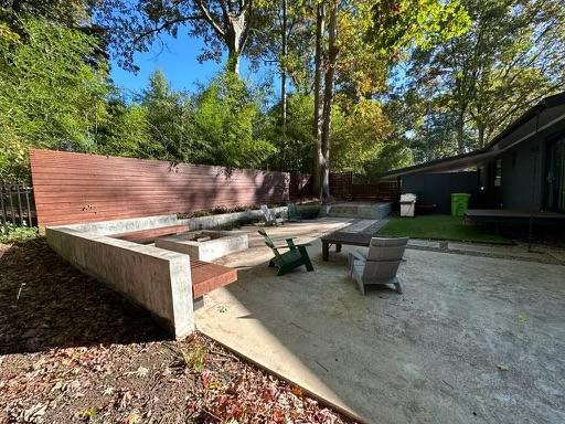 3322 Ocotea Street Raleigh, NC 27607 - Photo 19 of 31 a view of a backyard with sitting area
