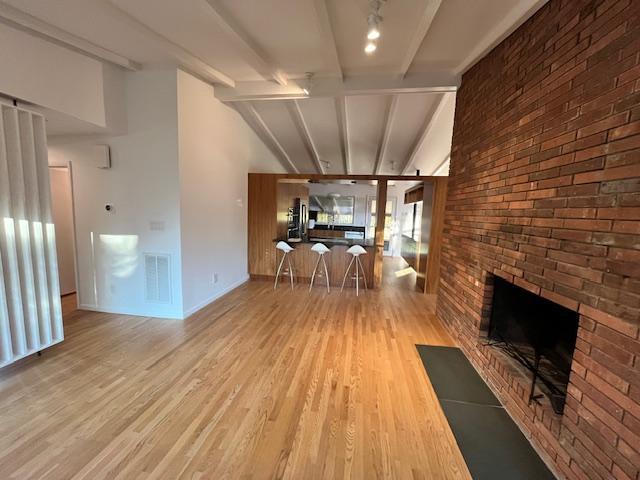 3322 Ocotea Street Raleigh, NC 27607 - Photo 28 of 31 a view of a livingroom with furniture wooden floor and front door