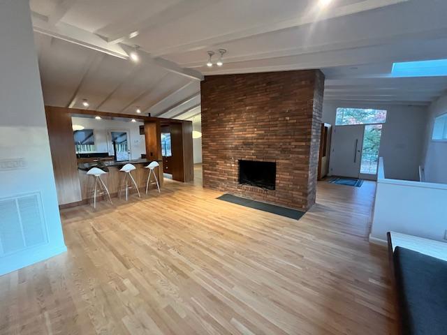 3322 Ocotea Street Raleigh, NC 27607 - Photo 29 of 31 a living room with furniture and a fireplace