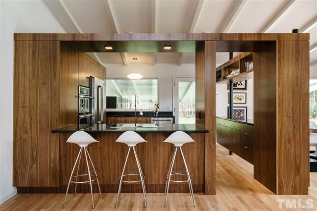 3322 Ocotea Street Raleigh, NC 27607 - Photo 10 of 31 a dining room with chairs and wooden floor