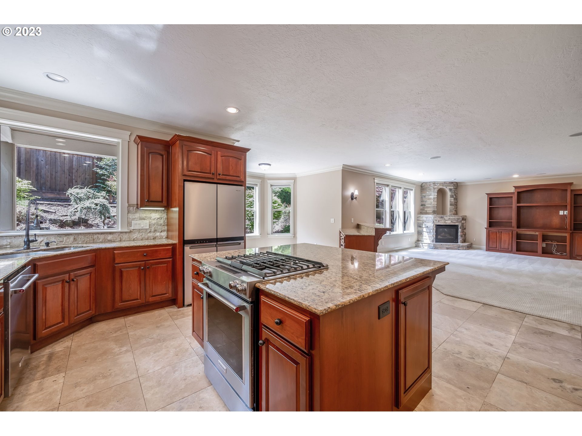 6143 Forest Ridge Drive Springfield, OR 97478 - Photo 11 of 48 a kitchen with stainless steel appliances granite countertop a stove a sink dishwasher and a refrigerator