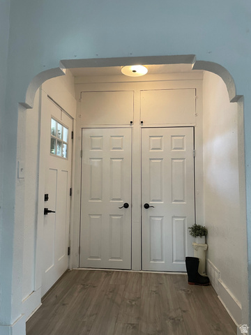 857 27th Street Ogden, UT 84403 - Photo 10 of 20 Entryway featuring wood-finish flooring and a white arched doorway