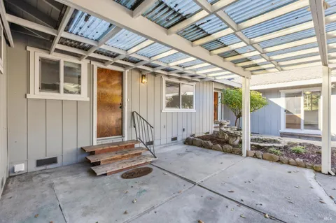 a kitchen with stainless steel appliances granite countertop a sink and a stove
