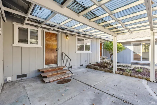 a kitchen with stainless steel appliances granite countertop a sink and a stove