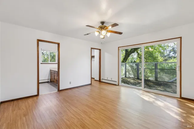 a view of an empty room with a fireplace