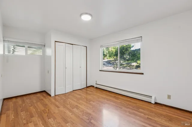 a view of a house with a porch and furniture