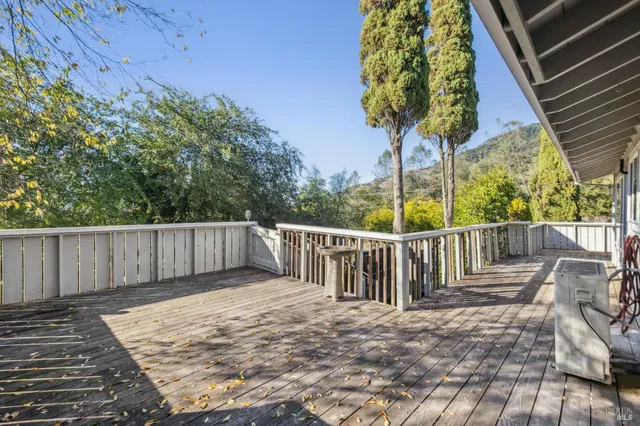 a view of balcony with wooden floor