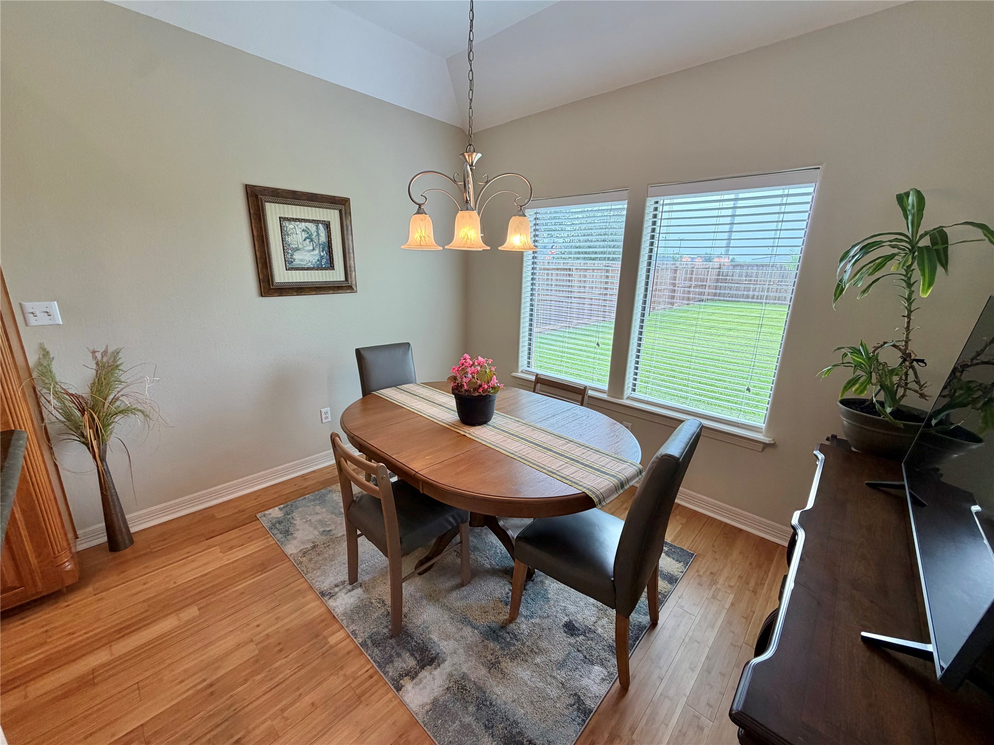 1448 South Blue Bonnet Lane Angleton, TX 77515 - Photo 16 of 43 a view of a dining room with furniture window and wooden floor