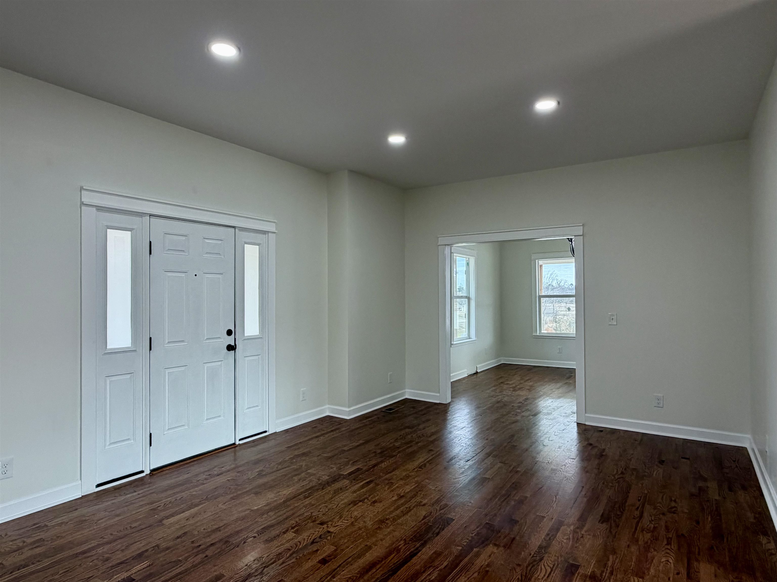 Entrance foyer featuring recessed lighting and dark wood-style floors