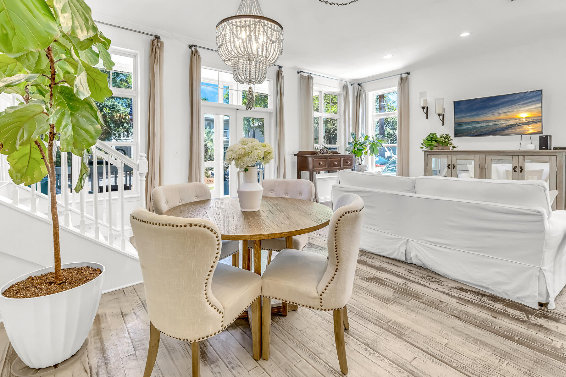 79 Redfish Circle Santa Rosa Beach, FL 32459 - Photo 2 of 33 a view of a dining room with furniture wooden floor and chandelier