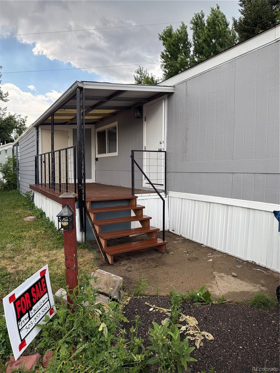 17190 Mt Vernon Road, Unit 176 Golden, CO 80401 - Photo 2 of 39 a front view of a house with garden