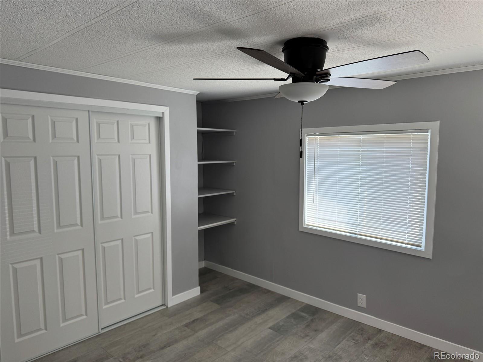 17190 Mt Vernon Road, Unit 176 Golden, CO 80401 - Photo 25 of 39 an empty room with a empty space and windows