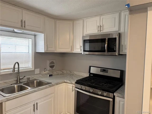 a view of a closet in kitchen