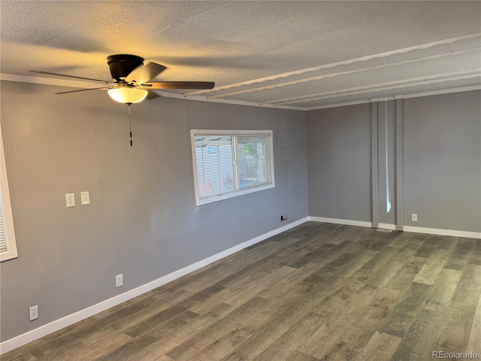 17190 Mt Vernon Road, Unit 176 Golden, CO 80401 - Photo 31 of 39 a view of an empty room with window and cabinet