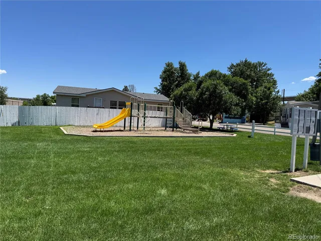 a view of a house with backyard porch and sitting area