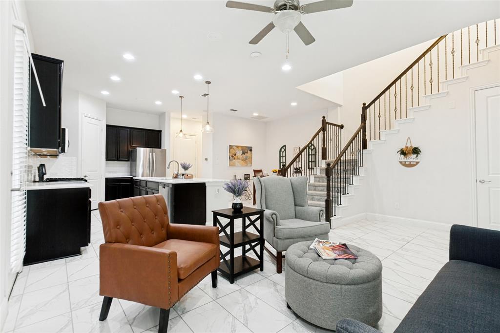 605 Ansley Way Allen, TX 75013 - Photo 7 of 28 Spacious open-concept living area featuring marble-finish tile flooring, recessed lighting, and a ceiling fan