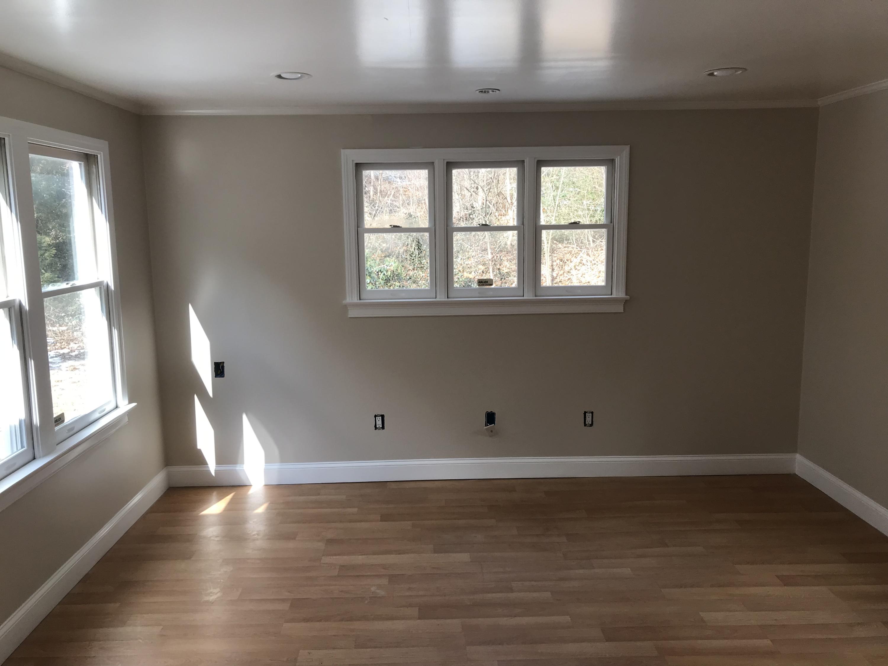 306 Old Mill Road Marstons Mills, MA 02648 - Photo 12 of 20 an empty room with wooden floor and windows