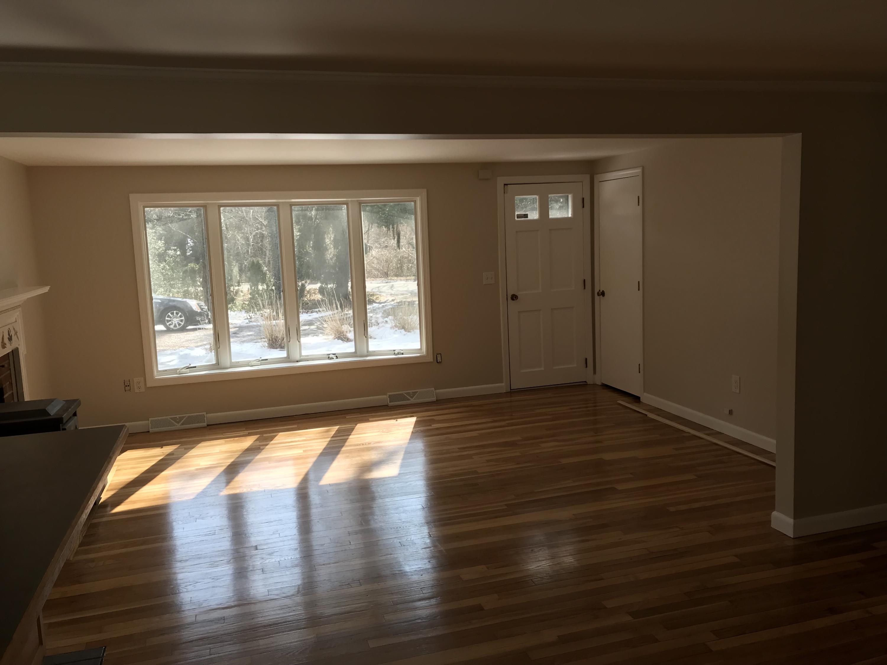 306 Old Mill Road Marstons Mills, MA 02648 - Photo 13 of 20 a view of an empty room with wooden floor and a window