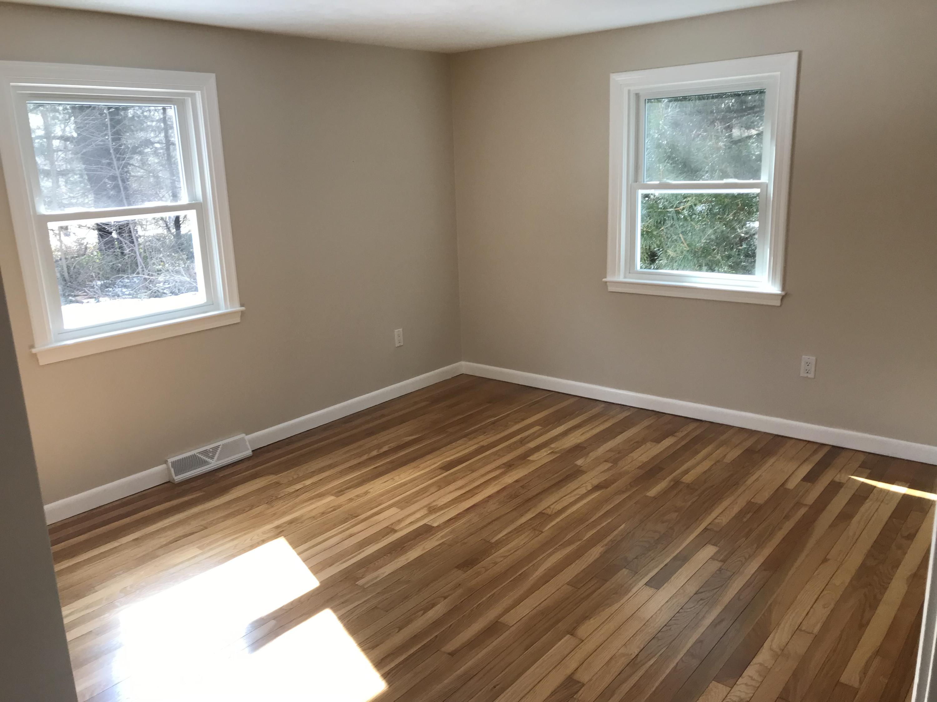 306 Old Mill Road Marstons Mills, MA 02648 - Photo 14 of 20 a view of an empty room with wooden floor and a window