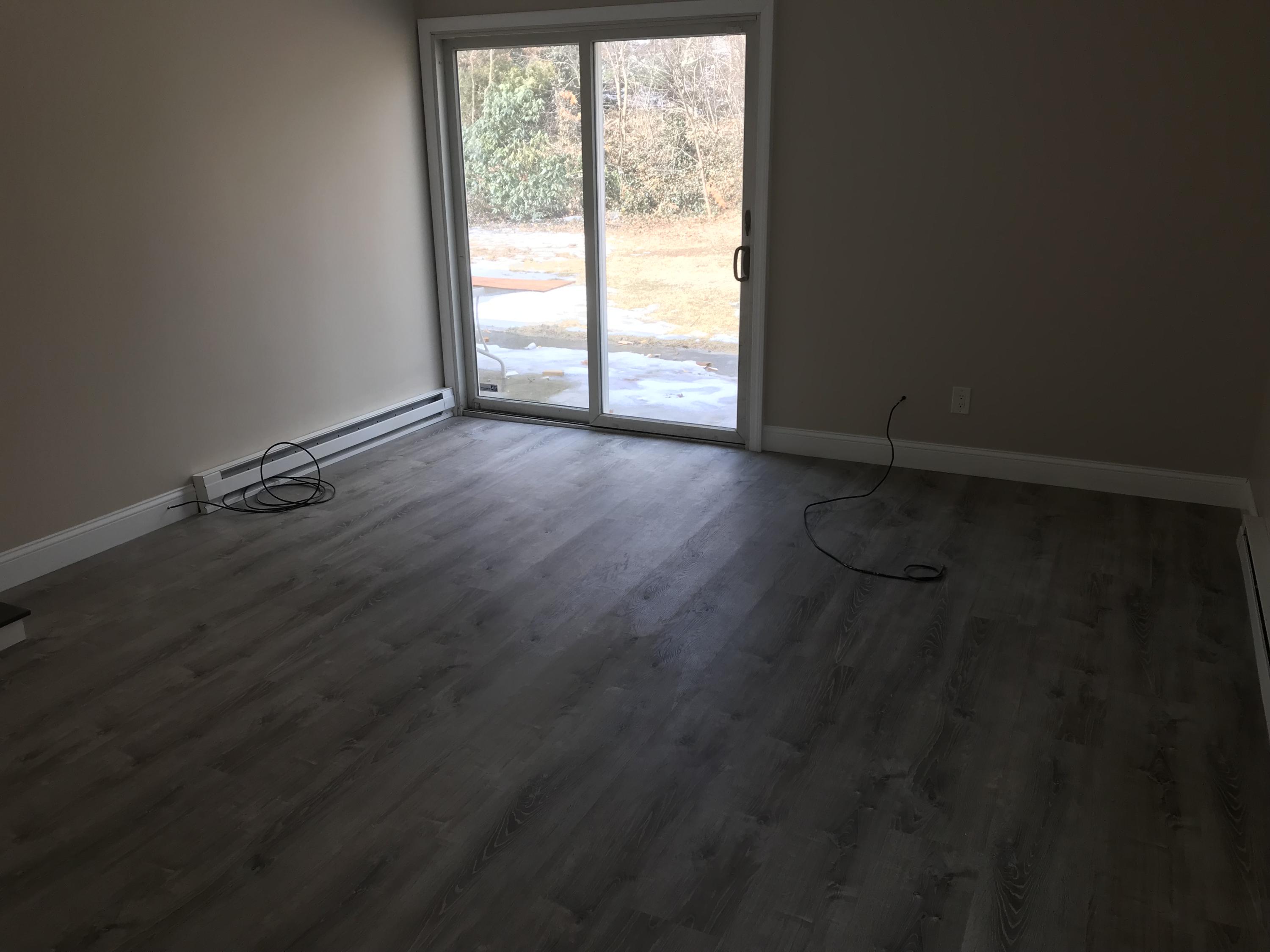 306 Old Mill Road Marstons Mills, MA 02648 - Photo 20 of 20 an empty room with wooden floor and windows