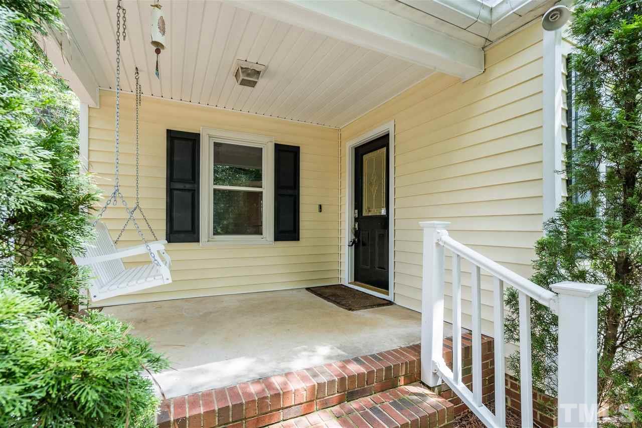 1234 Cross Link Road Raleigh, NC 27610 - Photo 2 of 26 a front view of a house with a garage