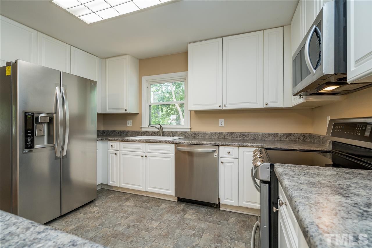 1234 Cross Link Road Raleigh, NC 27610 - Photo 13 of 26 a kitchen with stainless steel appliances granite countertop a refrigerator sink and stove