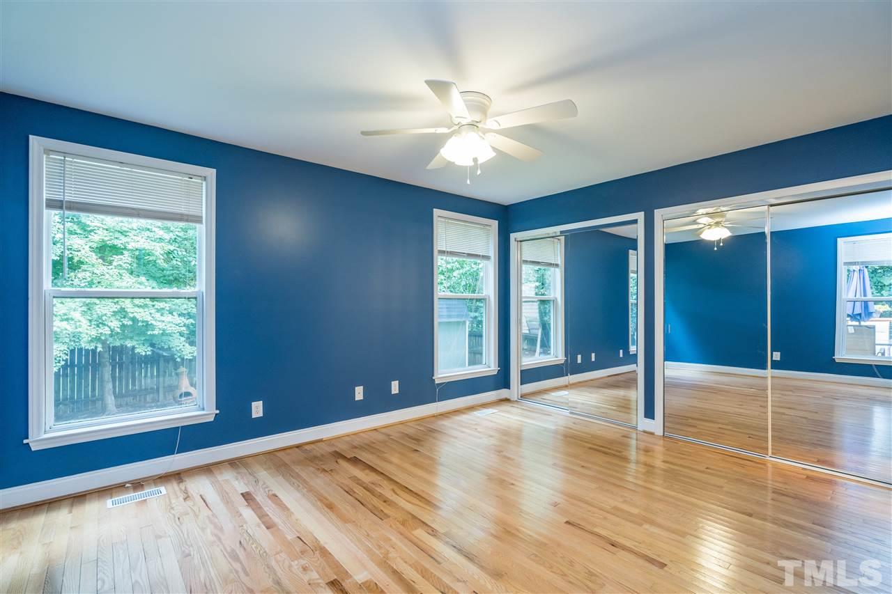 1234 Cross Link Road Raleigh, NC 27610 - Photo 14 of 26 a view of an empty room with glass door and a chandelier fan