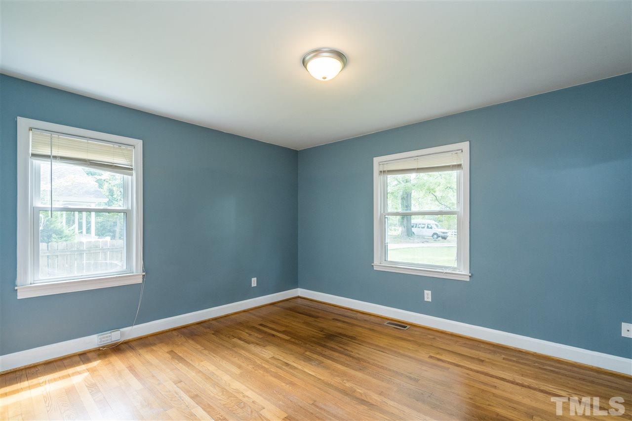 1234 Cross Link Road Raleigh, NC 27610 - Photo 18 of 26 a view of an empty room with a window