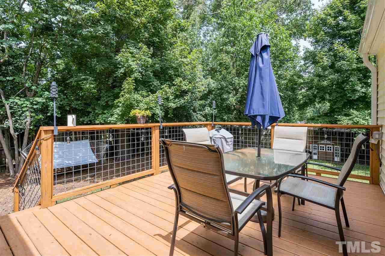 1234 Cross Link Road Raleigh, NC 27610 - Photo 21 of 26 a view of a chairs and table on the deck