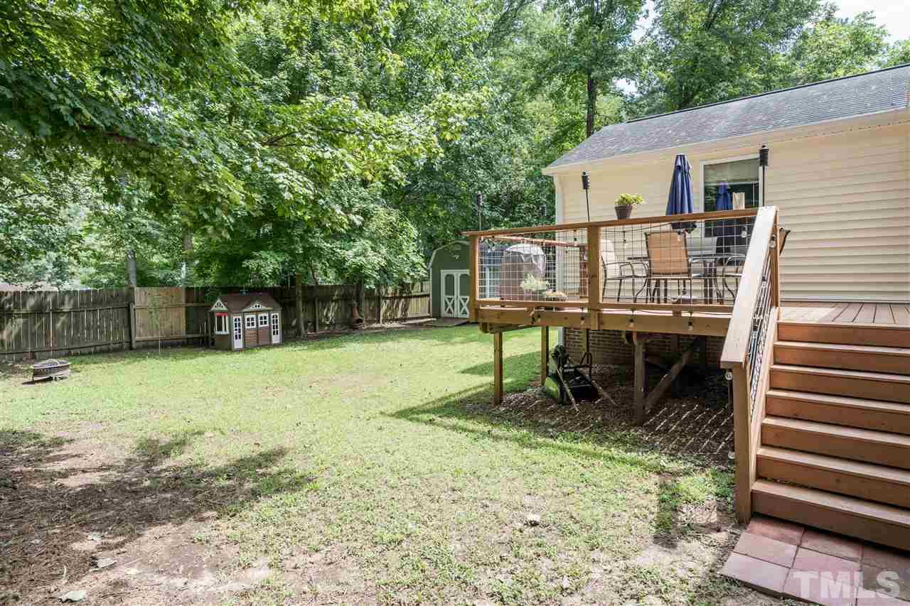 1234 Cross Link Road Raleigh, NC 27610 - Photo 22 of 26 a view of a house with backyard and sitting area