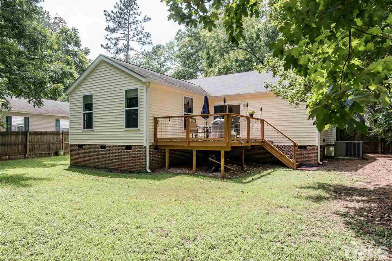 1234 Cross Link Road Raleigh, NC 27610 - Photo 23 of 26 a backyard of a house with yard and trampoline