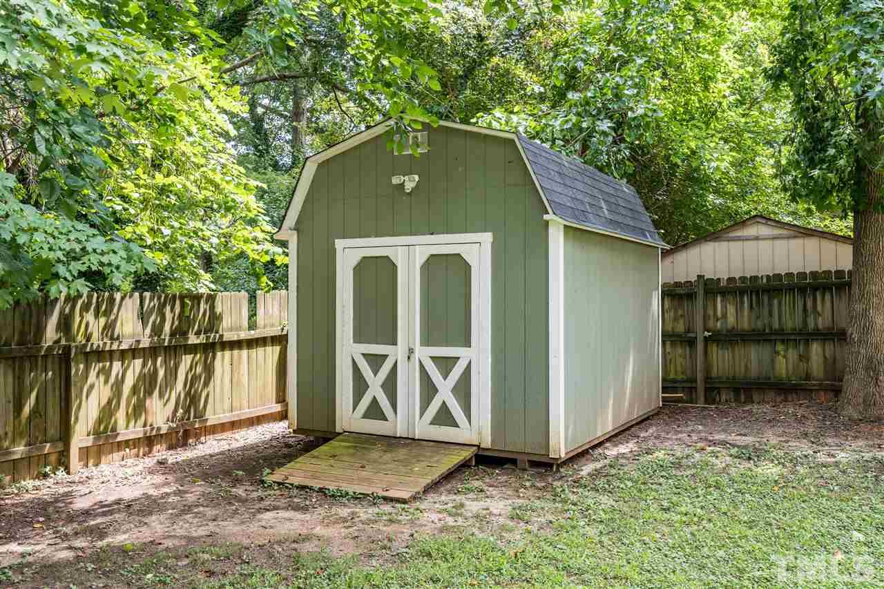 1234 Cross Link Road Raleigh, NC 27610 - Photo 25 of 26 a front view of a house with a yard