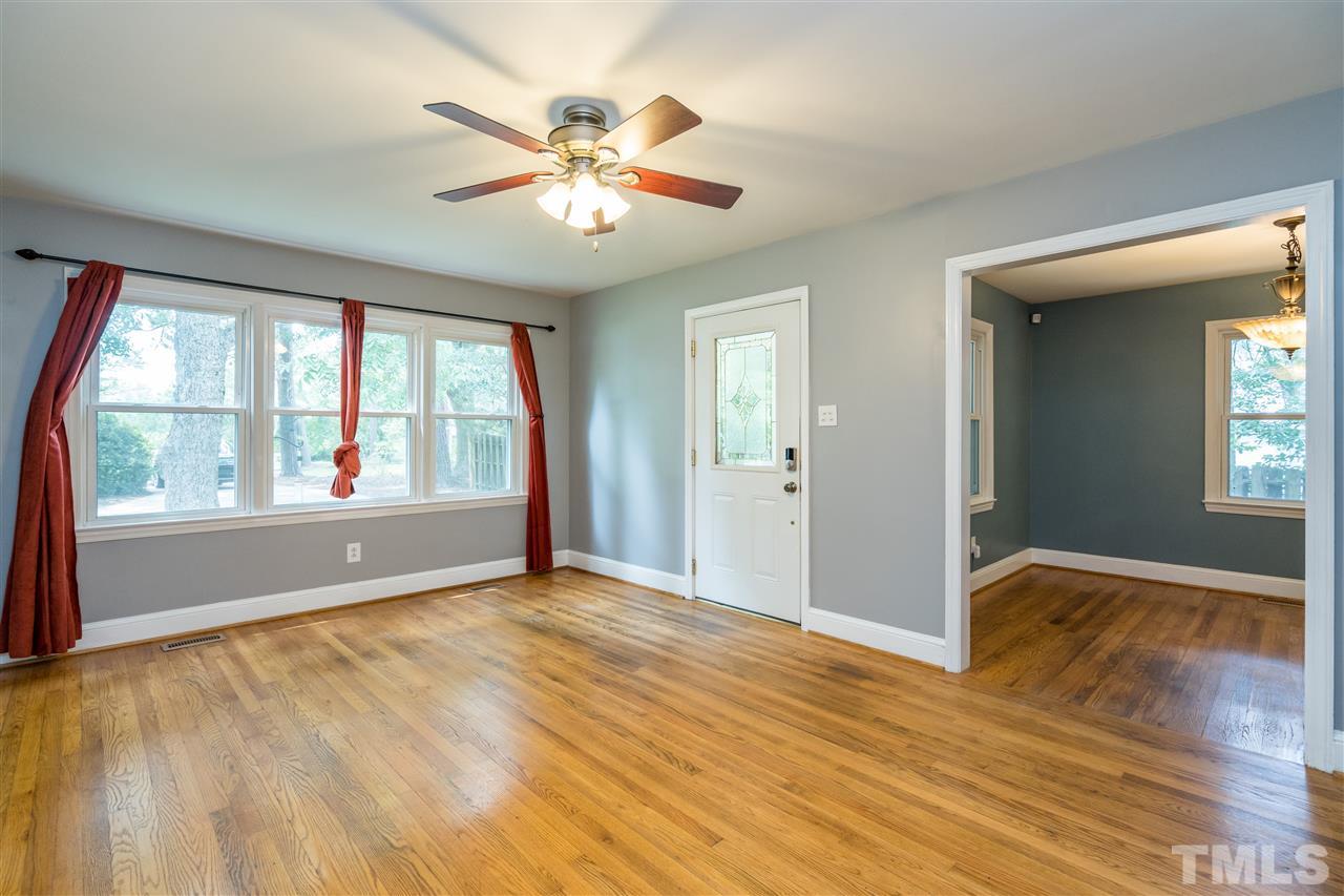 1234 Cross Link Road Raleigh, NC 27610 - Photo 6 of 26 a view of an empty room with a window
