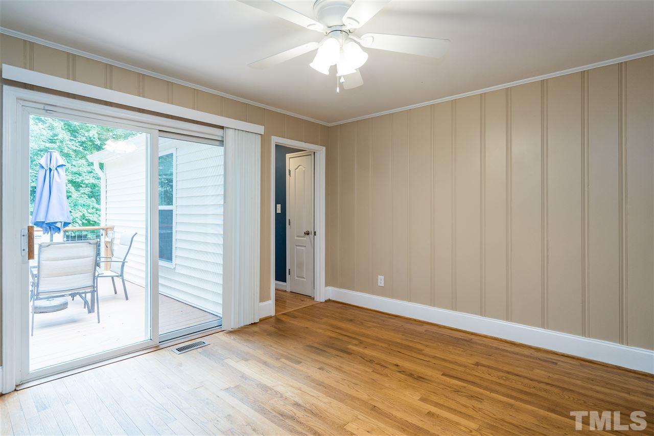 1234 Cross Link Road Raleigh, NC 27610 - Photo 9 of 26 a view of an empty room with a window