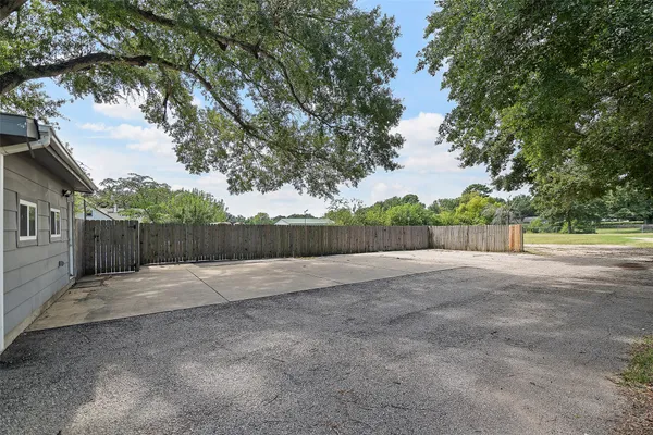 a view of backyard space and trees