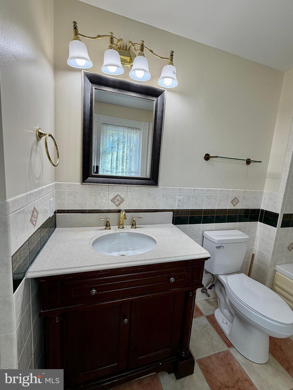 48600 Deep Cove Lane Ridge, MD 20680 - Photo 16 of 46 a bathroom with a toilet sink and mirror
