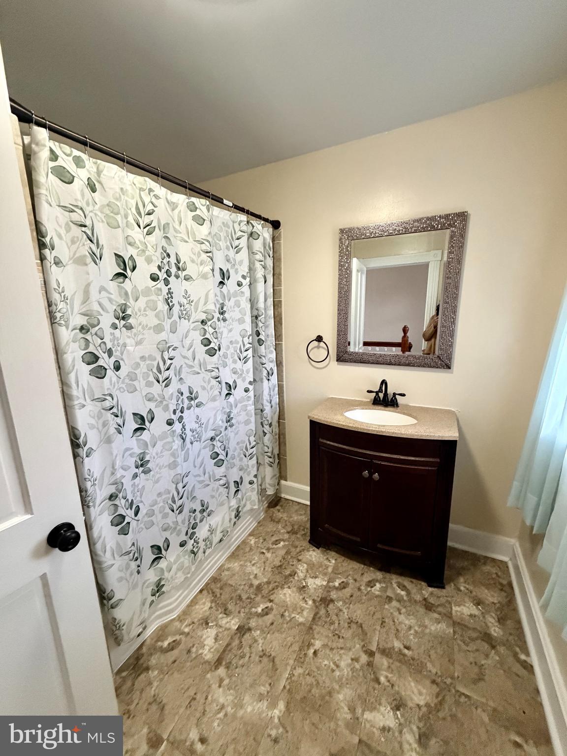 48600 Deep Cove Lane Ridge, MD 20680 - Photo 22 of 46 a bathroom with a bathtub and shower