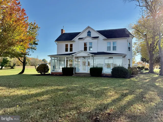 a view of a lake with houses in the back