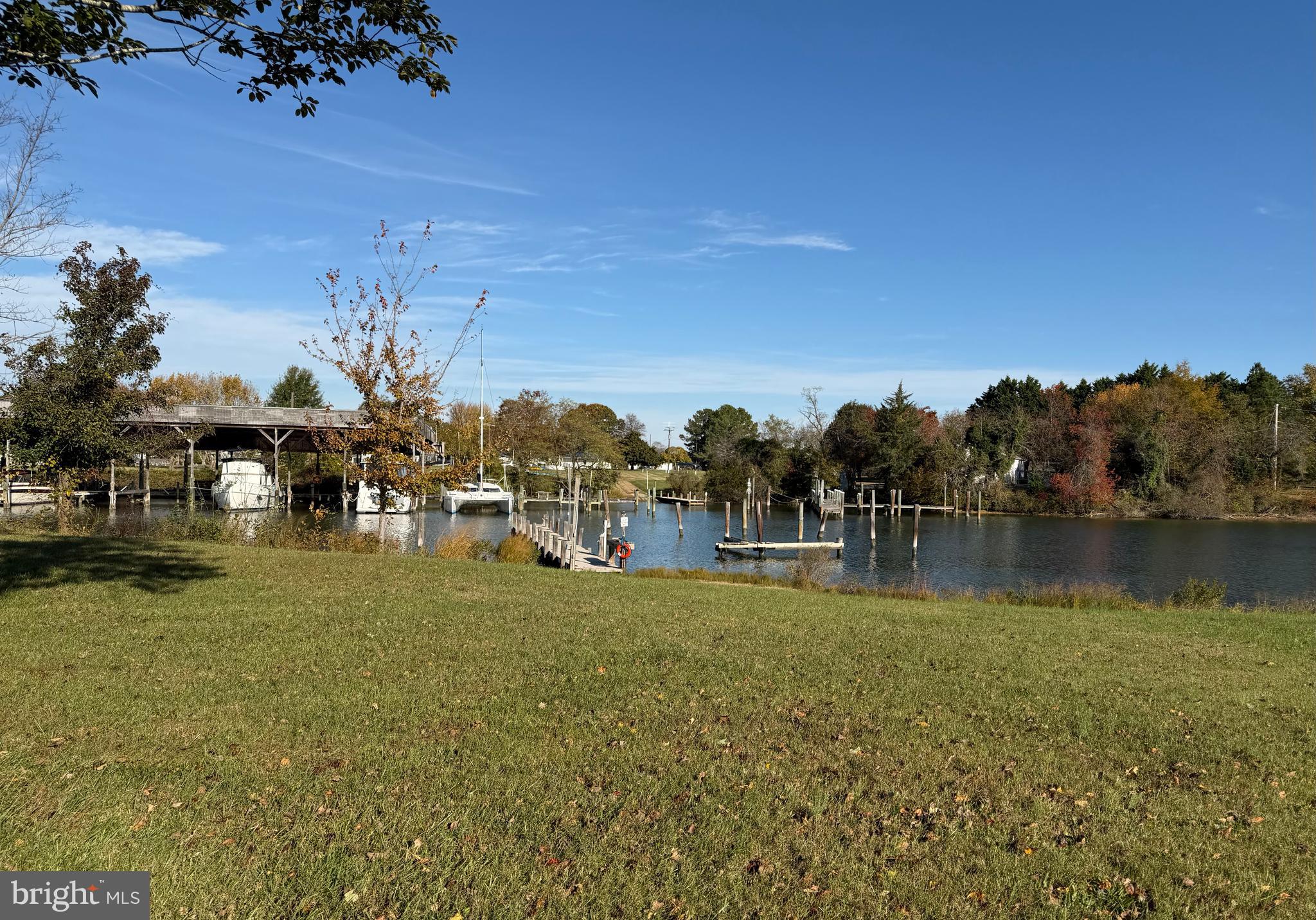 48600 Deep Cove Lane Ridge, MD 20680 - Photo 31 of 46 a view of a lake with houses in the back
