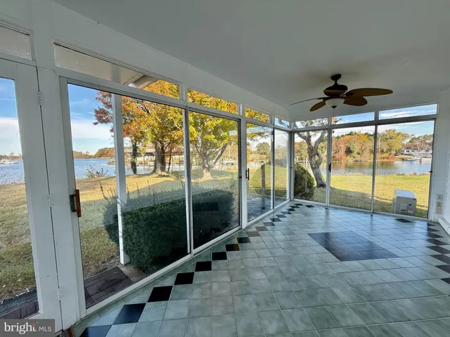 a bathroom with a glass door shower and a sink