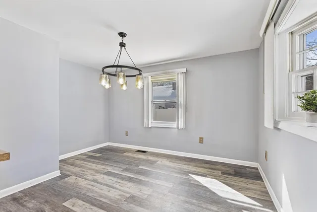 a room with a window and ceiling fan