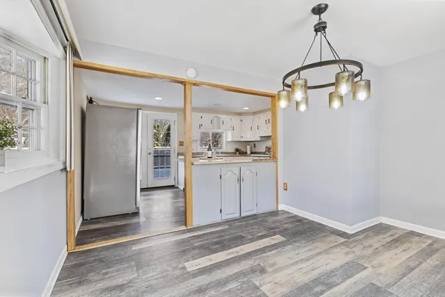 a view of a kitchen with a sink and cabinet