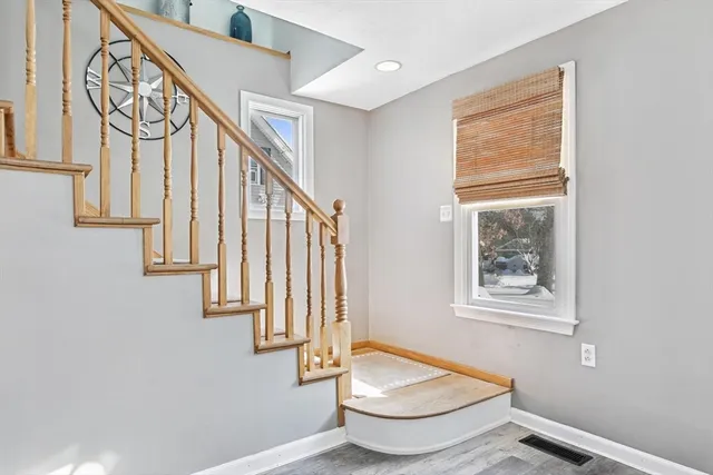 a bathroom with a tub and a window