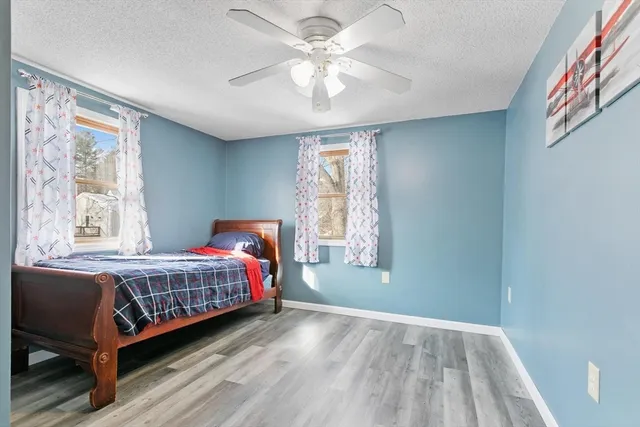 a bed room with a bed and a window