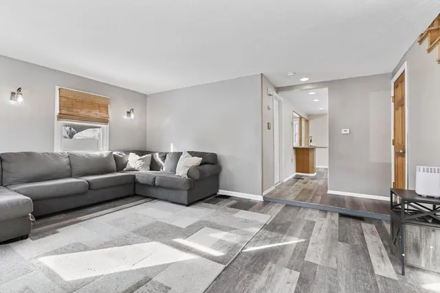 a living room with furniture and a table