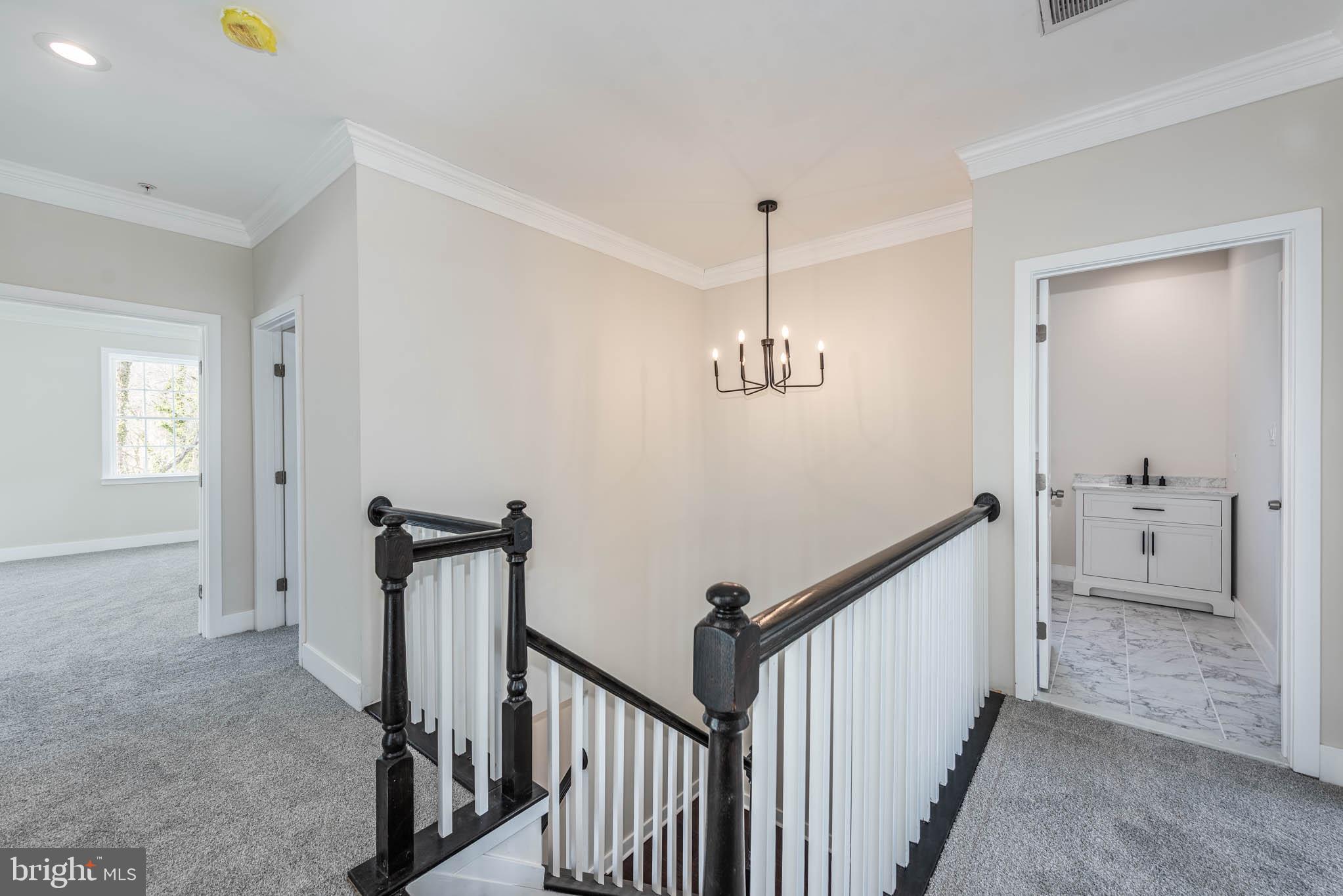 9624 Harford Road Parkville, MD 21234 - Photo 13 of 39 a view of a hallway with a chandelier