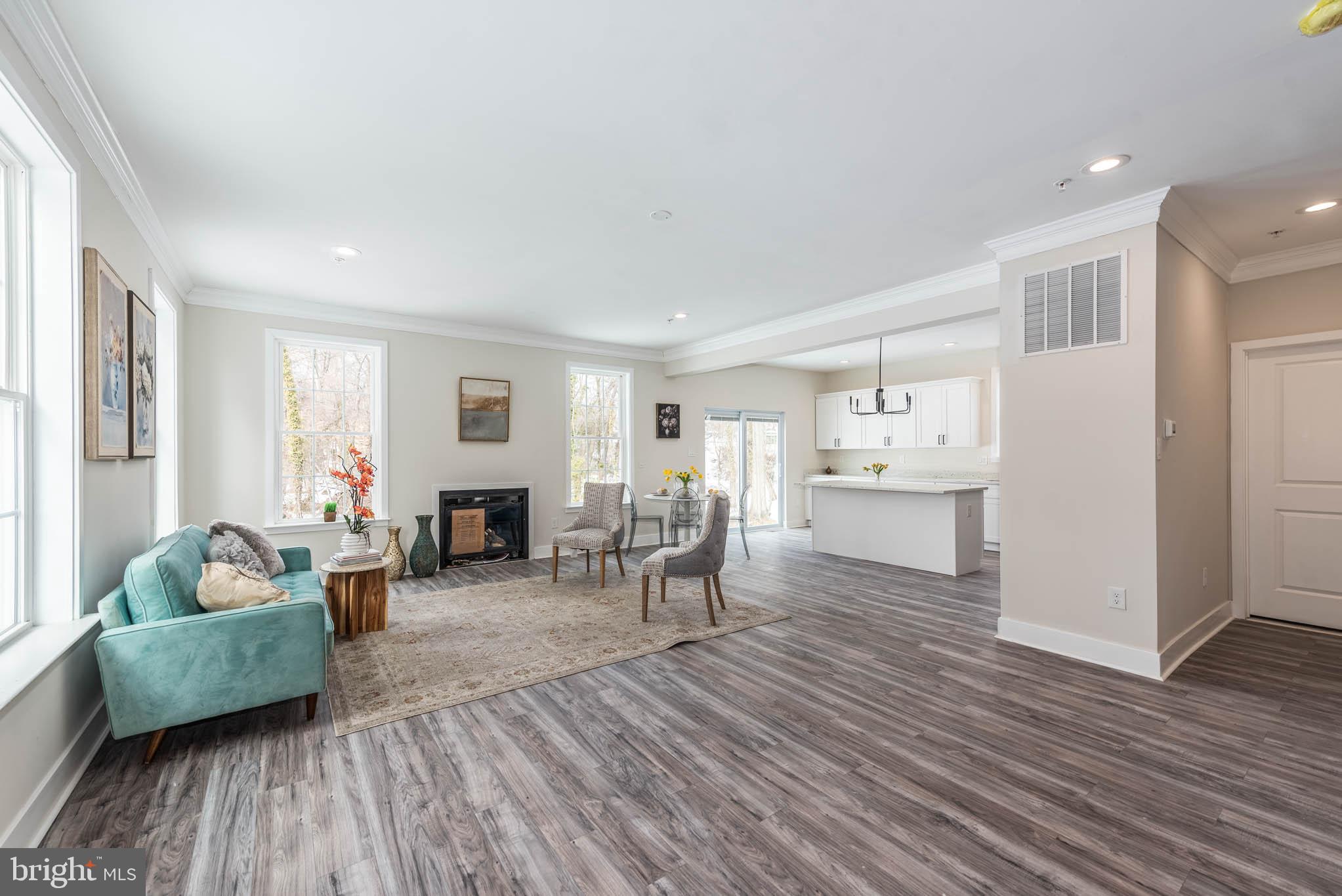 9624 Harford Road Parkville, MD 21234 - Photo 2 of 39 a living room with furniture and a wooden floor