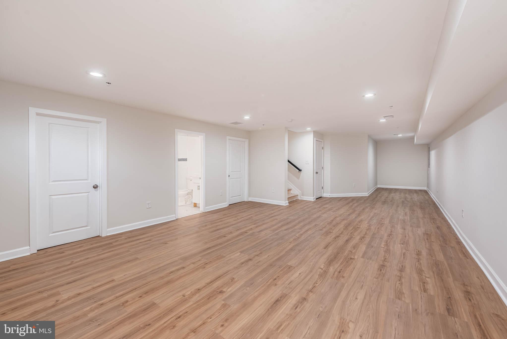 9624 Harford Road Parkville, MD 21234 - Photo 30 of 39 a view of empty room with wooden floor