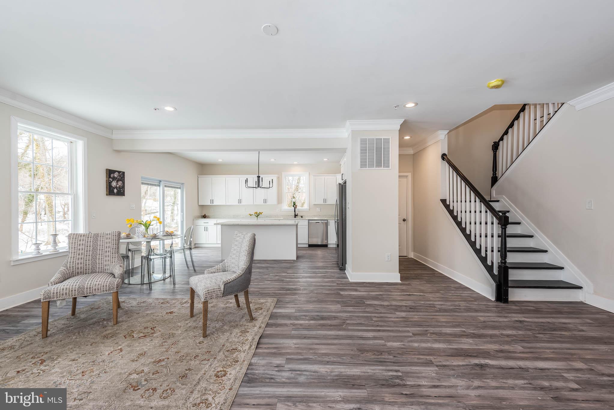 9624 Harford Road Parkville, MD 21234 - Photo 3 of 39 a living room with furniture and a wooden floor