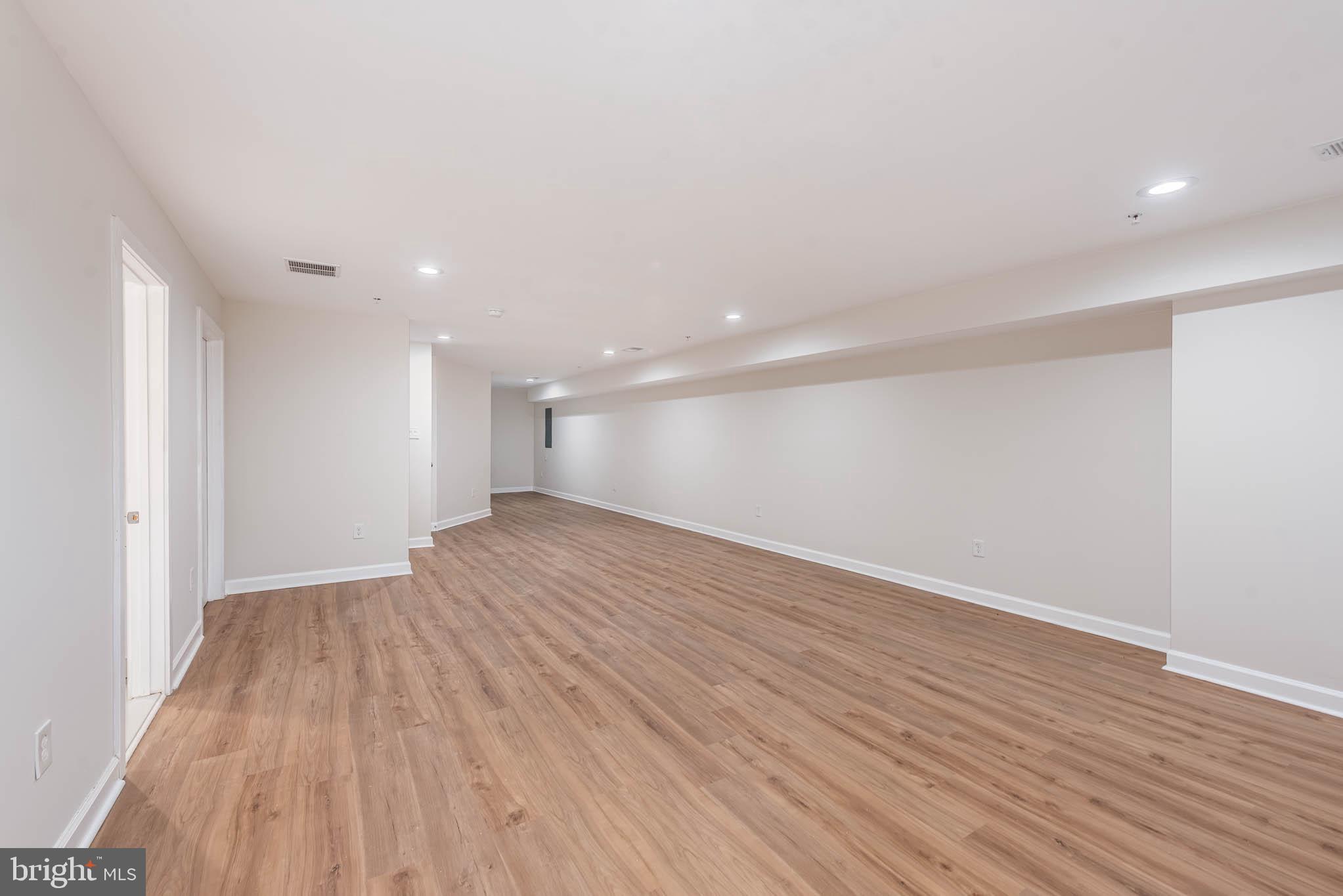 9624 Harford Road Parkville, MD 21234 - Photo 31 of 39 wooden floor in an empty room with wooden floor